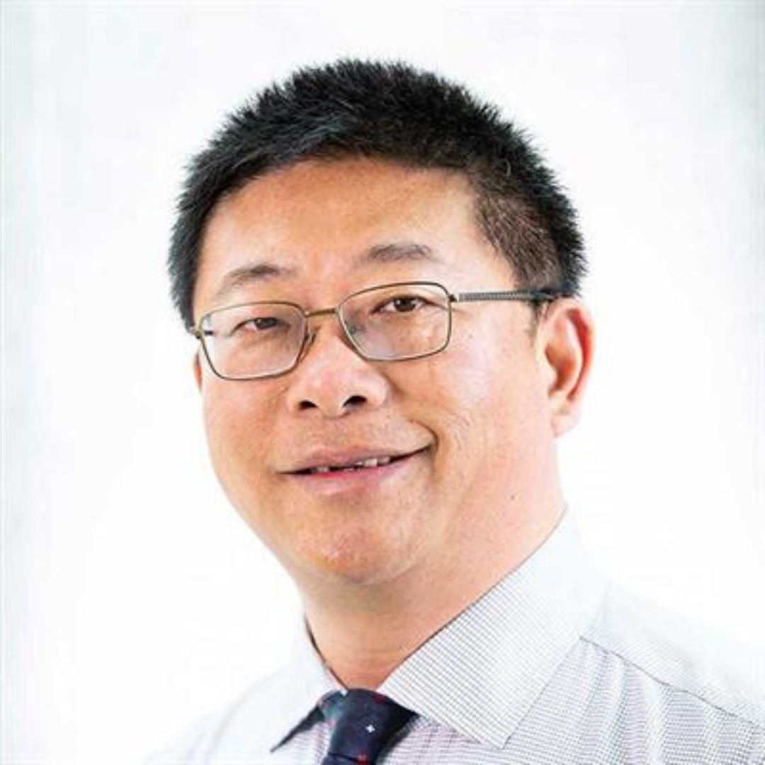 Headshot of Dr. Justin Jin, a smiling man wearing glasses and a white collared shirt.